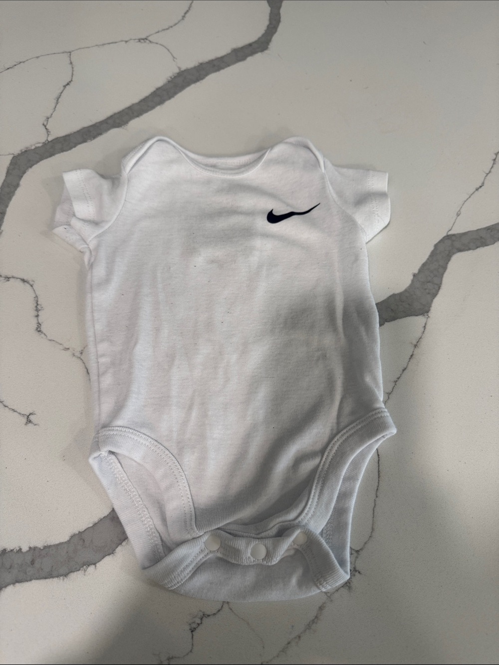 Nike White Infant Bodysuit with Black Swoosh
